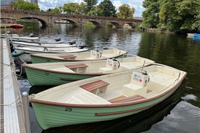 Image of some boats moored up on a river